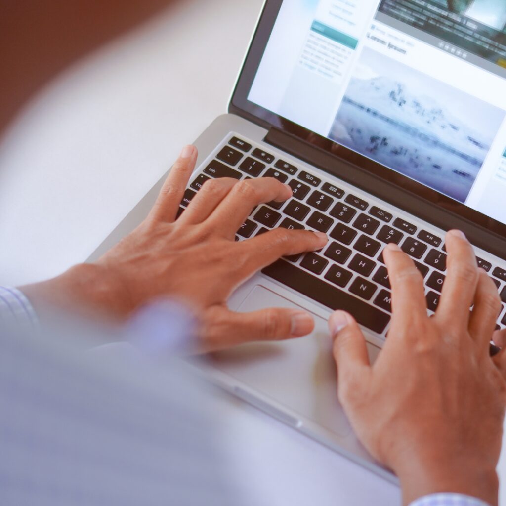 a person typing on a laptop