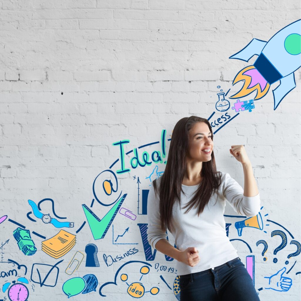 A happy women posing infront of a graffiti